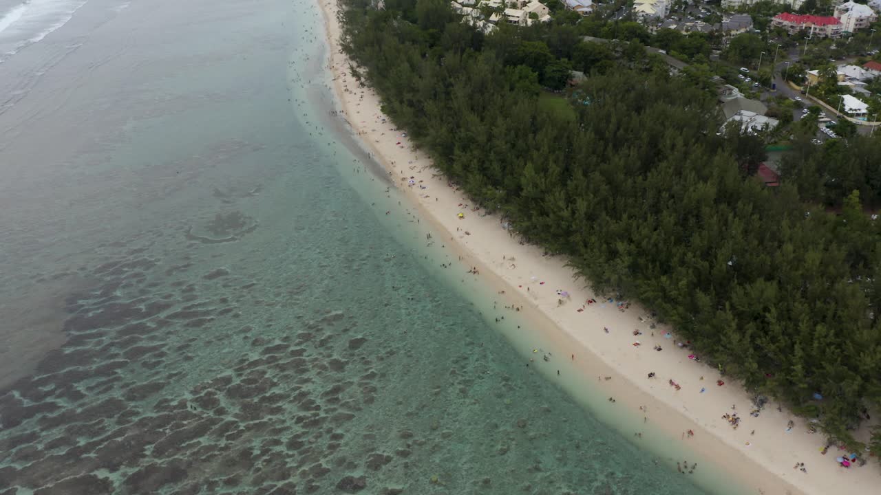 Beautiful top down aerial view of the coral reef and blue lagoon at the Ermitage Beach, Reunion Island, France