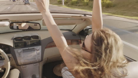 woman enjoying a road trip in a convertible