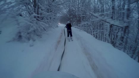 skier being pulled by an off-road car