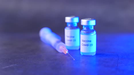 covid-19 vaccine and syringe