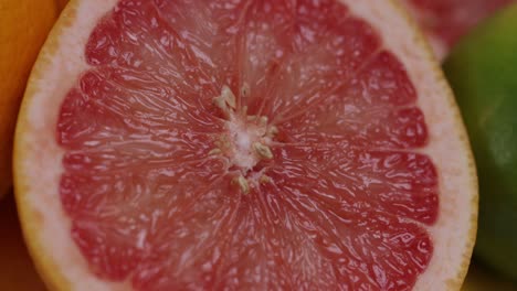 close up of grapefruit halved and other citrus fruits