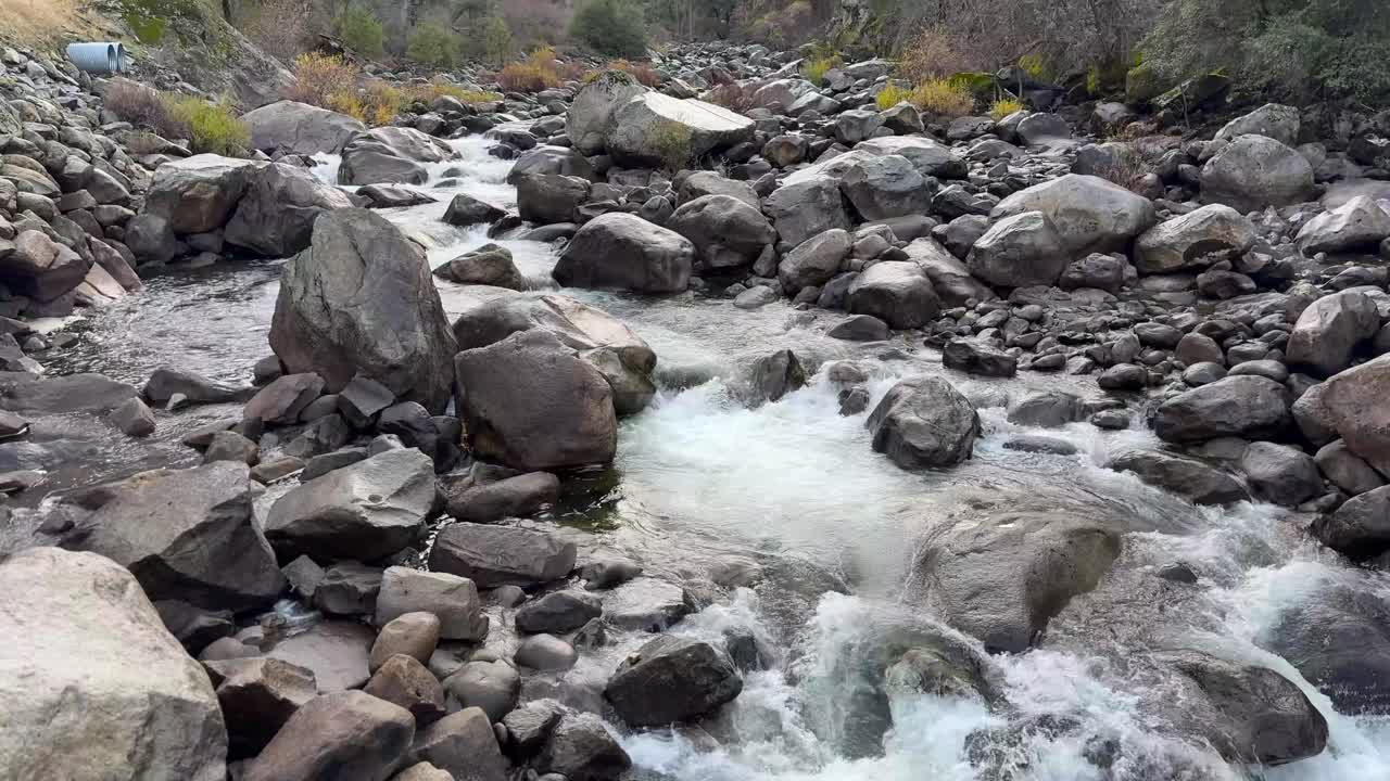 fast moving creek at the entrance to yosemite national park TILT UP
