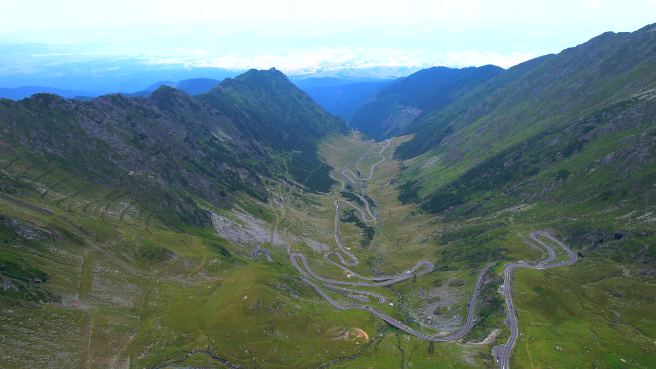 Romanian mountainous road of Transfagarasan. Aerial dolly out