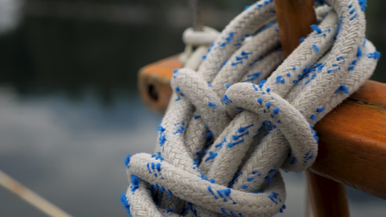 Slider shot of bundles of rope on a sailboat deck