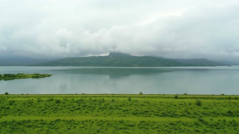 beautiful pawna dam view in rainy season drone moving bottom to top view