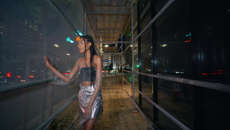 glamour model strolling night town portrait. brown skin chick woman walking city