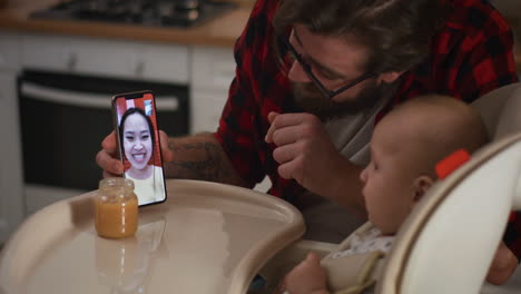 father video chatting with baby and mother