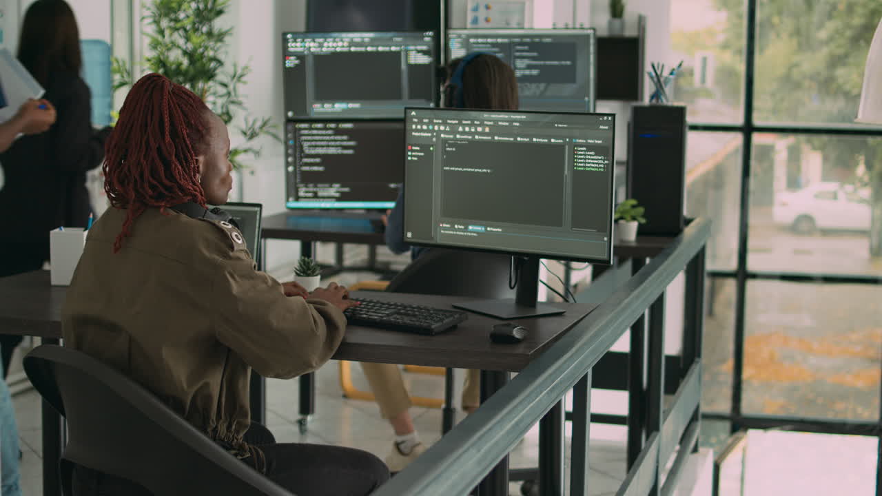 App software developer typing machine learning app code on computer