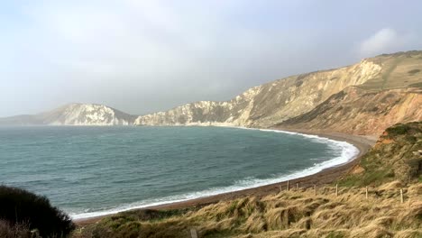 beautiful shot of an empty beach and cove on the jurassic coast in dorset, england