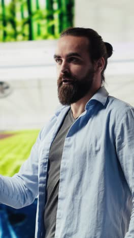vertical video young happy adult focused on online connection and scrolling on social pages