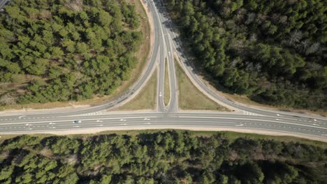 aerial: highway in the forest which lead to three dircetions