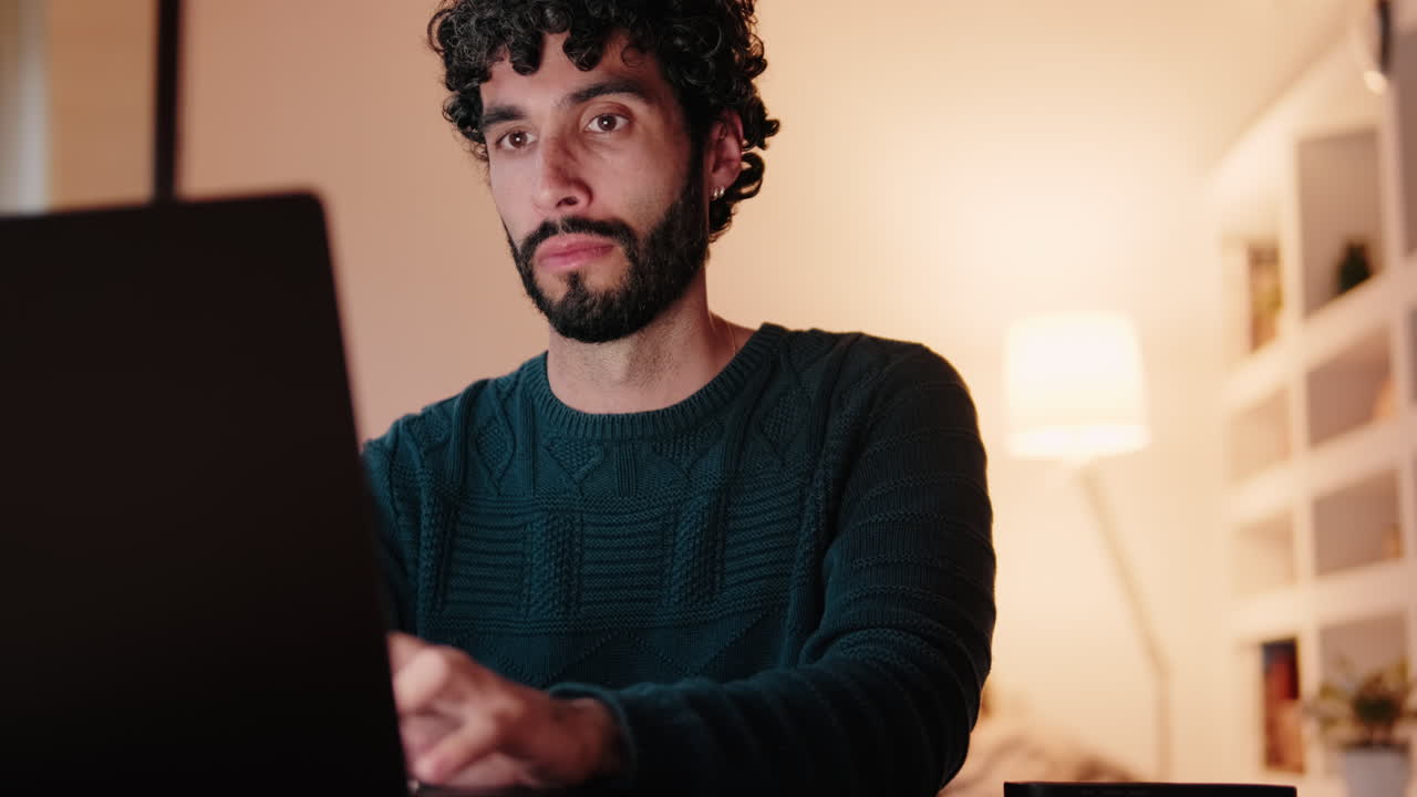 Gay Couple at Home Working on Laptop