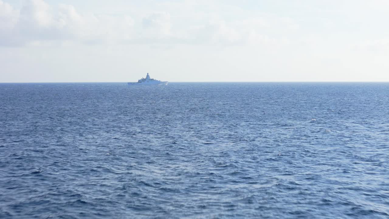 Drone orbit of an offshore patrol vessel, cruising in the open sea, highlighting naval operations