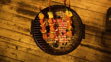 skewers cooking evenly on a round grill