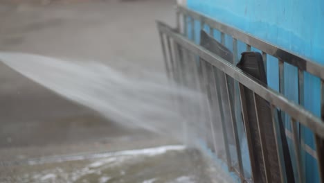 pressure washing a metal frame structure