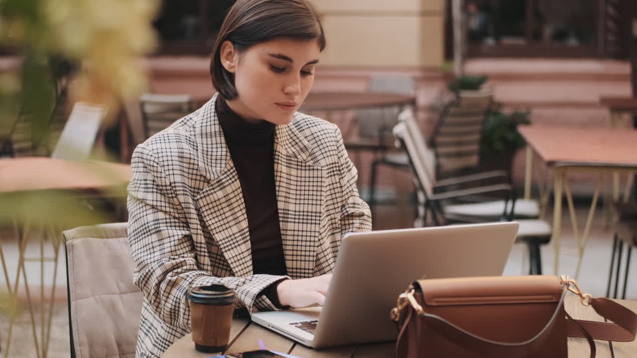 Businesswoman in a coffee break outdoor.