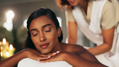 woman receiving a relaxing massage at a spa
