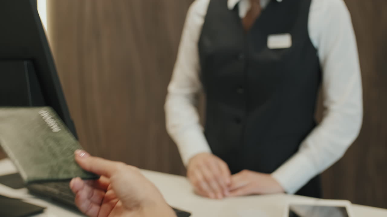 Giving Passport to Receptionist at Check-In