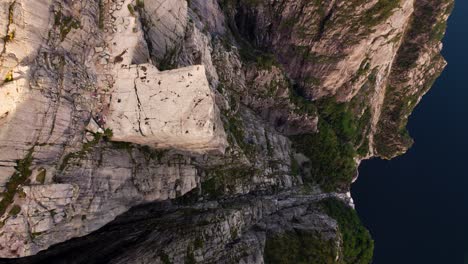 panoramic drone view of preikestolen edge dropping steeply to lysefjord. tourist norway landscape.