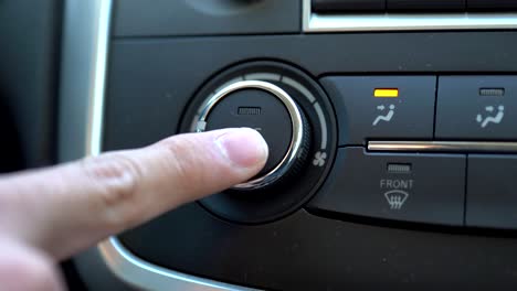 turning on air conditioner of a car