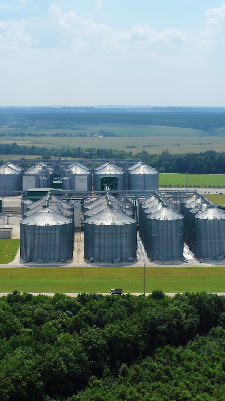 Steel silos for storing grain. Aerial view of big agricultural factory storages