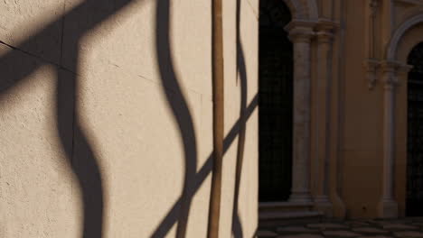 shadows on a stone wall