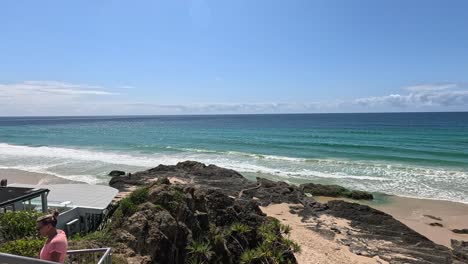 waves crashing on rocks at currumbin beach