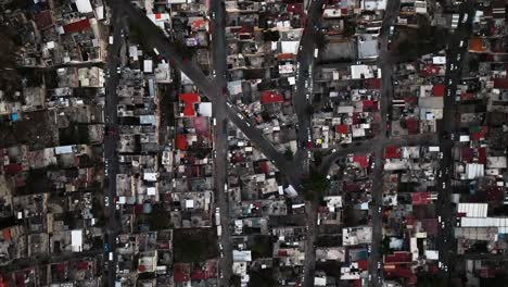 aerial view above houses and streets in favela naucalpan, mexico city - top down, drone shot