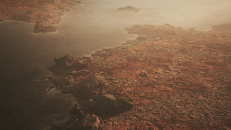 beautiful view of foggy mountains with a reflection in a lake