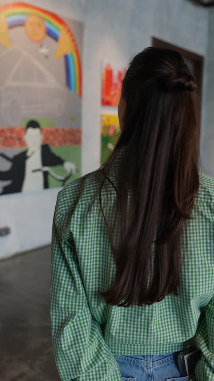 Woman Viewing Art in an Art Gallery