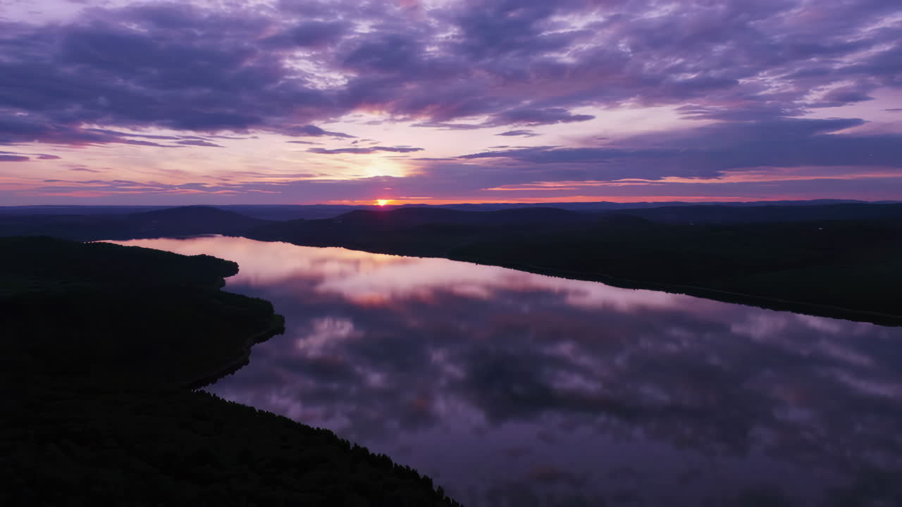 Serene Sunset Over Mountain Lake