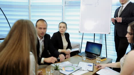 corporate communication teamwork concept. business people working in conference room, view through the blinds on the window