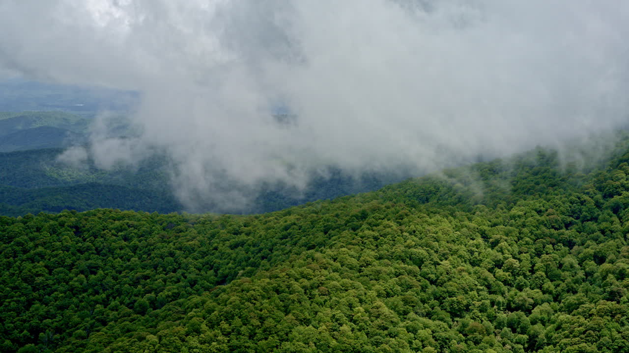 Aerial footage reveals a brooding Smoky Mountain scene wrapped in mist and moisture