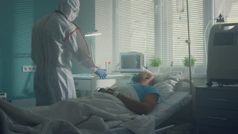 male patient breathing oxygen mask in clinic. hospital ward equipment interior.