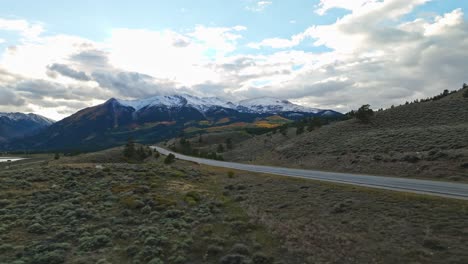 drone shot of an open plain leading to a large lake, framed by distant mountains in independence pass