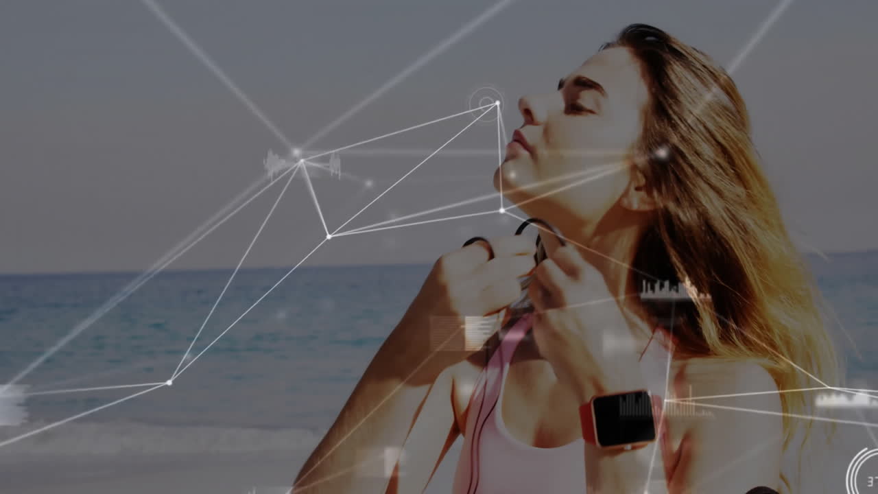 Woman adjusting earphones on beach with digital network overlay animation