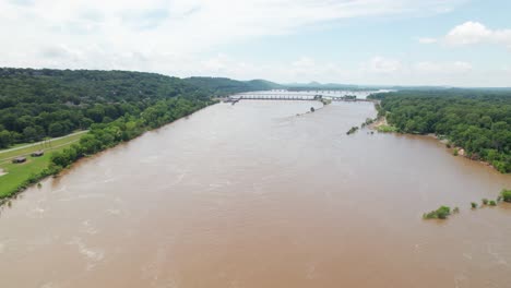aerial footage of arkansas river in little rock arkansas. camera is heading approximately west toward the big dam bridge