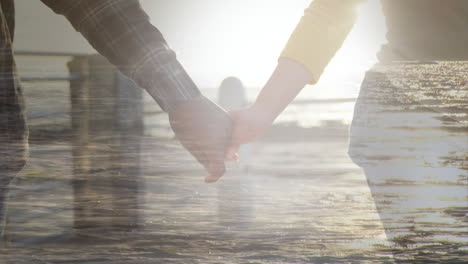 animation of couple at beach holding hands over cityscape