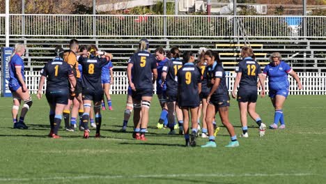 rugby players discussing strategy during practice