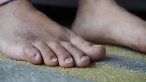 close-up of a person's feet on a carpet