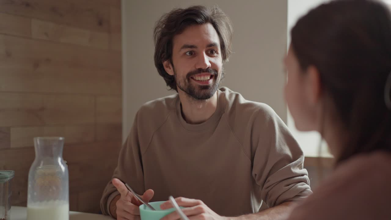 Couple having breakfast at the table