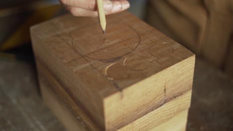 Carpenter-Marking-a-Circle-onto-Wood-for-Routing