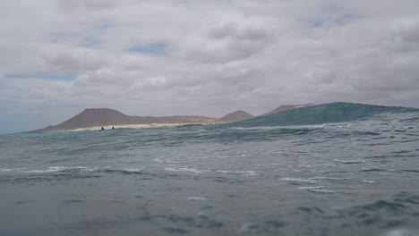 pov emerging from underwater in slow motion.