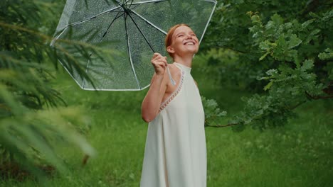 woman enjoying a rainy day in the forest