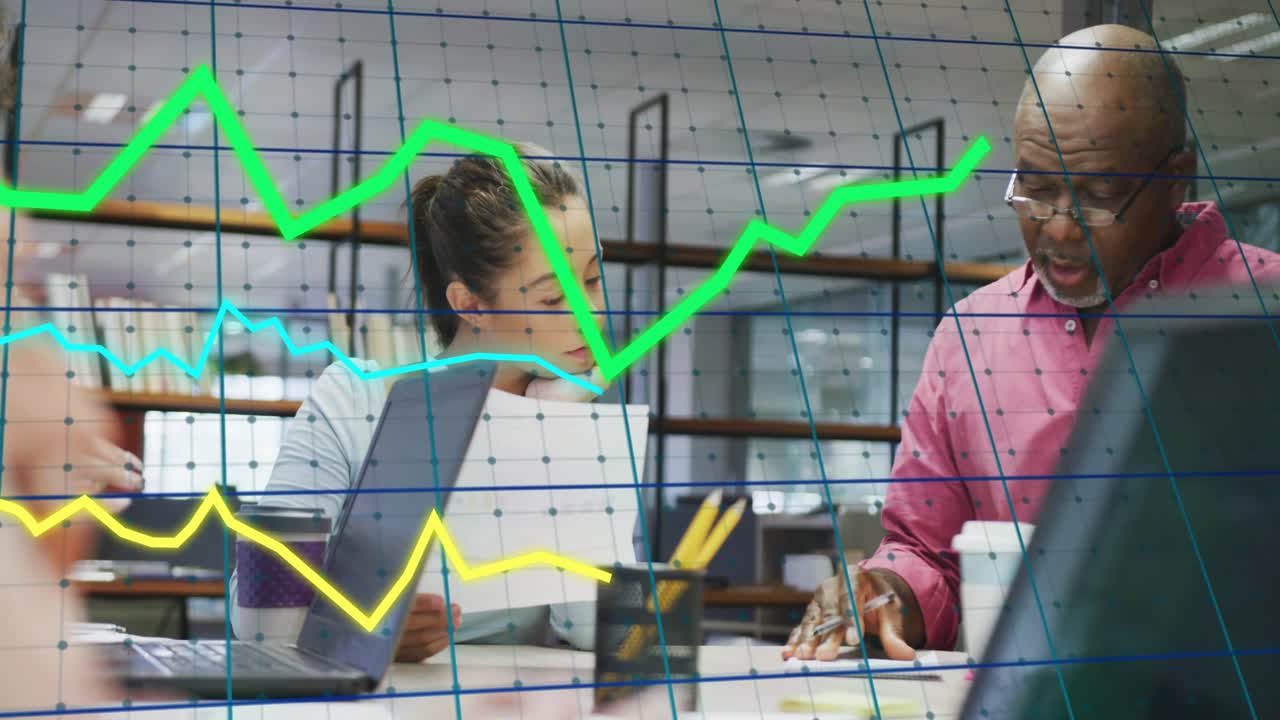 Center woman holding doc urging senior man pointing and noting overlay charts showing business data