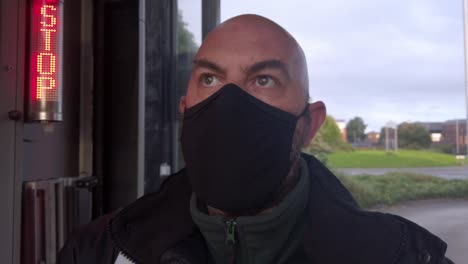 male opening car wash workplace wearing ppe corona virus face mask at digital stop sign