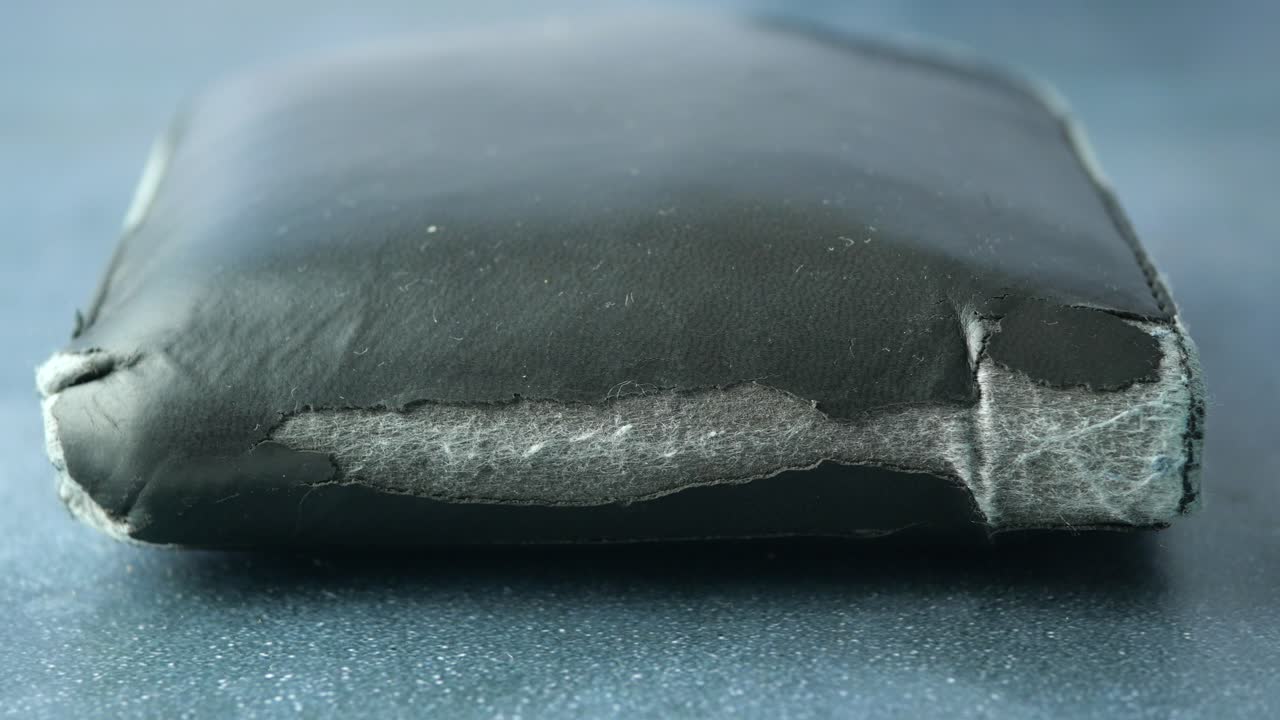 Damaged Black Leather Wallet