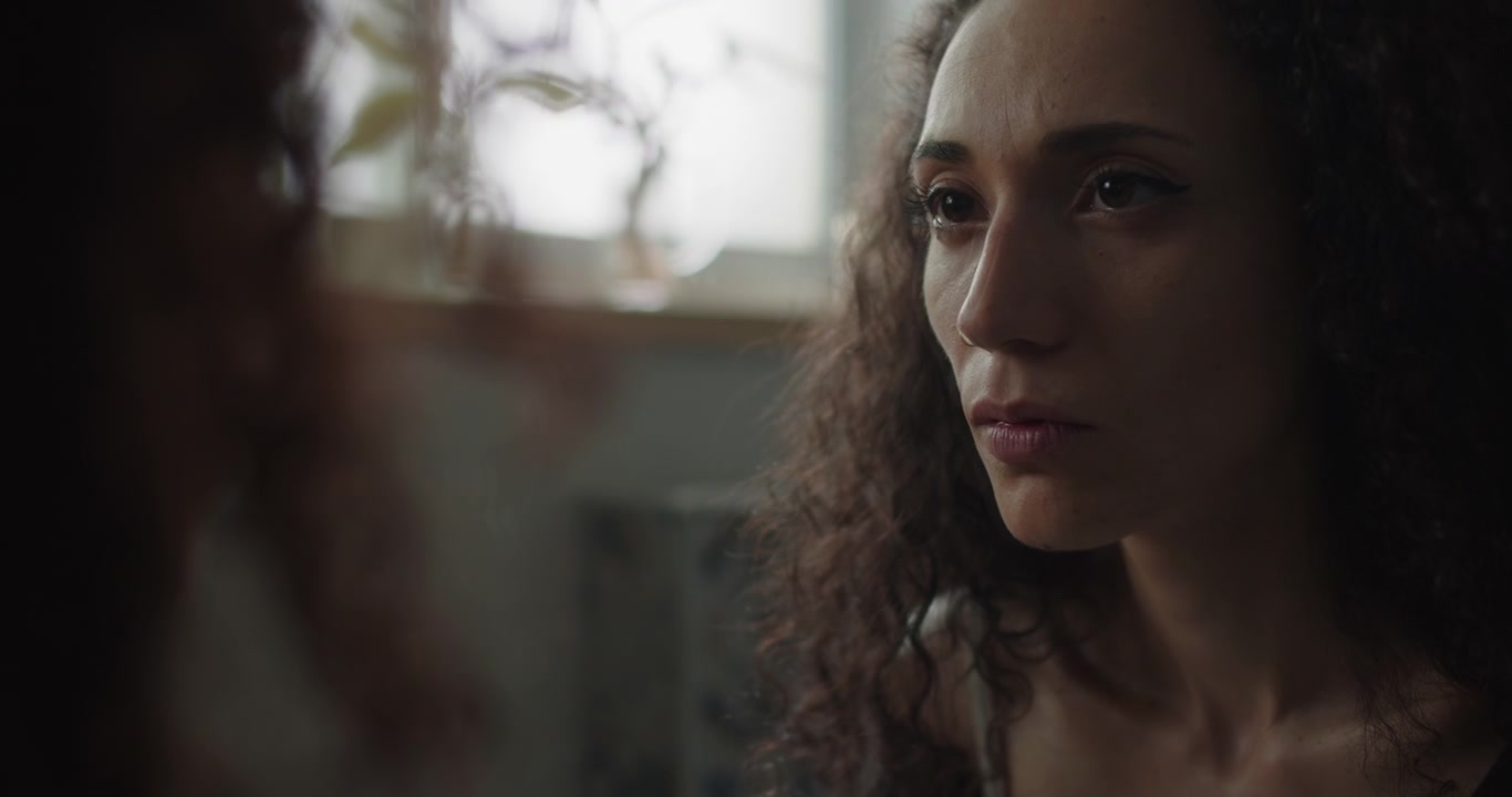 Reflection of an insecure young woman