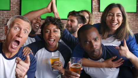 friends watching game in sports bar on screens shot on r3d