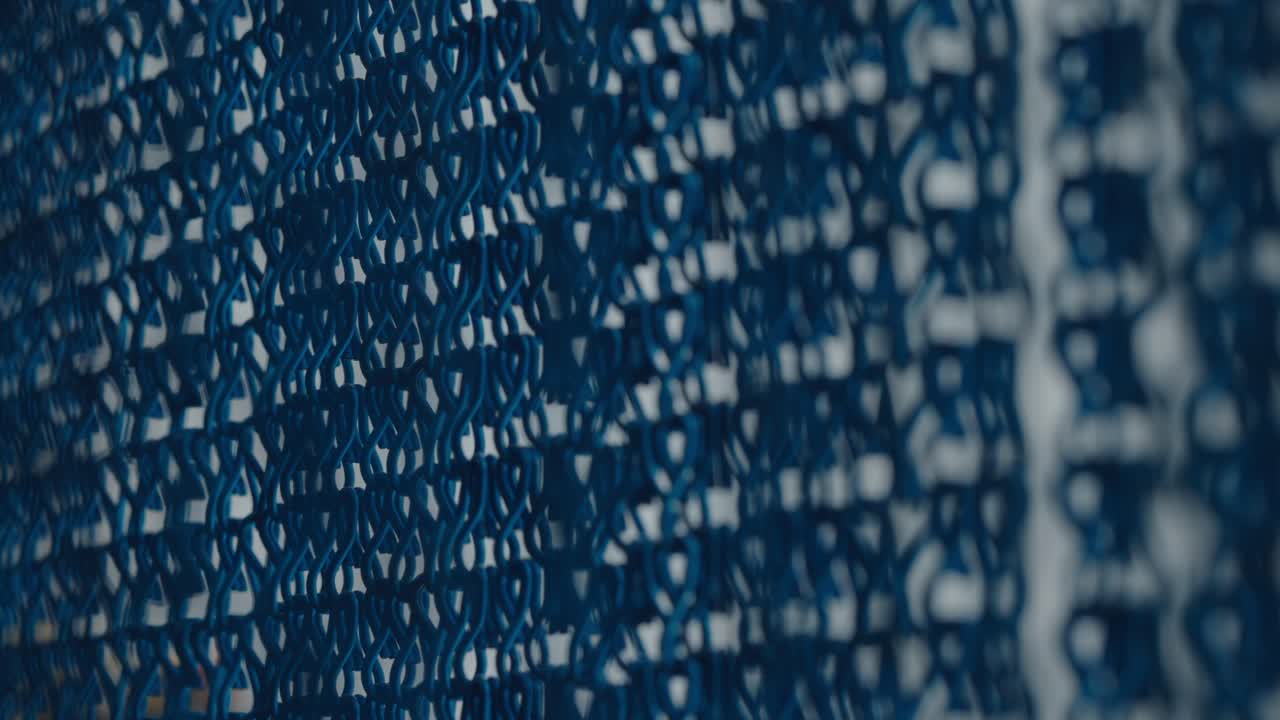 Metallic rings curtain in dark background